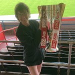 glos.info Director visits Cheltenham Town FC to hold the League 2 trophy